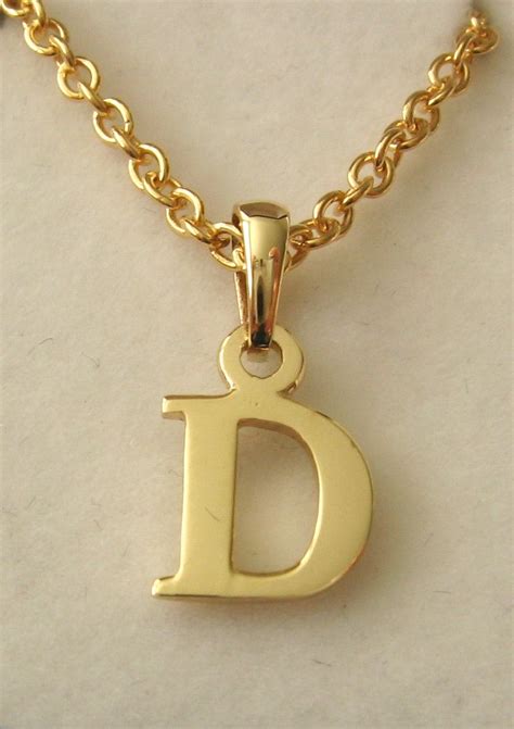 9ct gold letter pendant.